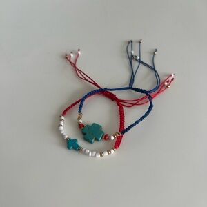 Set of two thread bracelets with turquoise cross